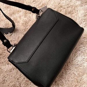 Louis Vuitton lock Me top handle/ shoulder bag